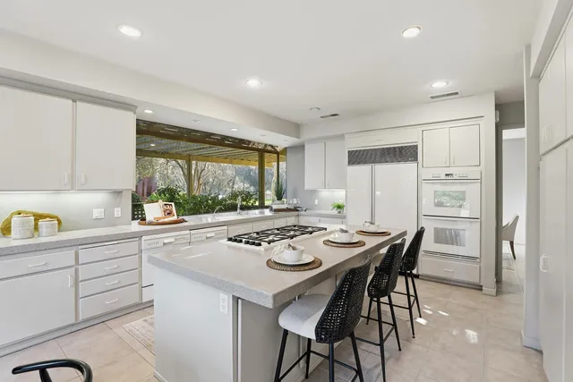 a bedroom with a bed and a table