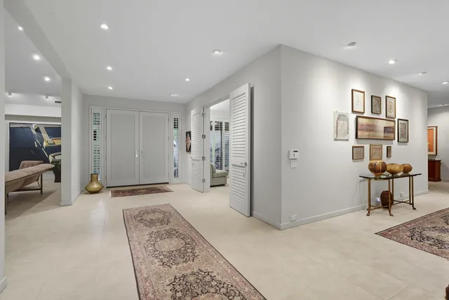 a view of a big room with entryway table and windows