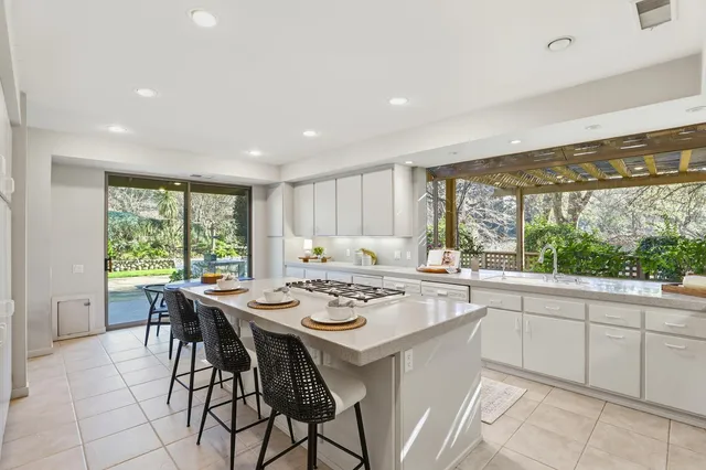 a kitchen with a table chairs and a stove