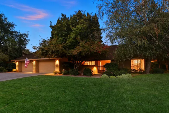 a backyard of a house with lots of green space