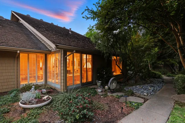 a backyard of a house with garden