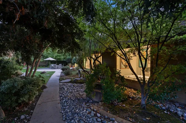a front view of a house with garden