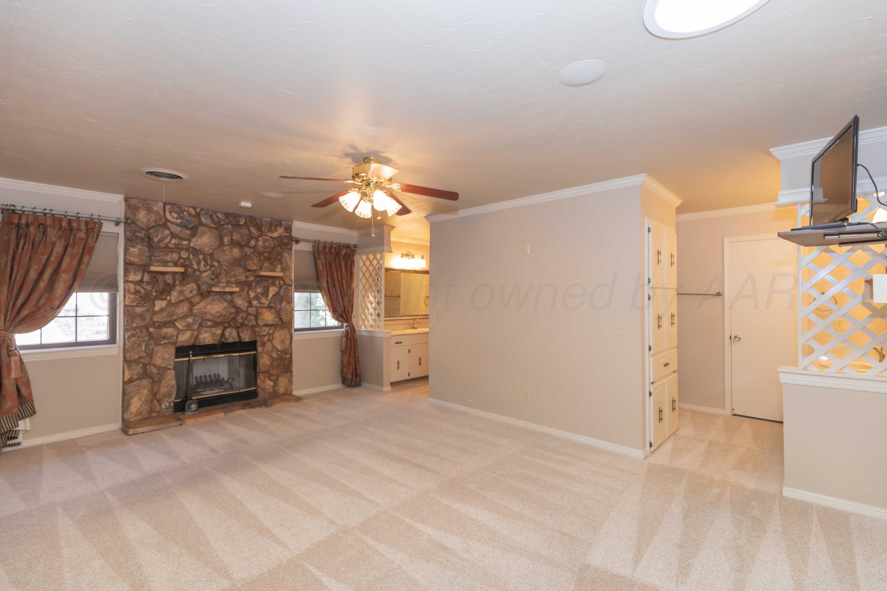 5809 Stone Drive Amarillo, TX 79109 - Photo 22 of 47 a view of a livingroom with a fireplace and window