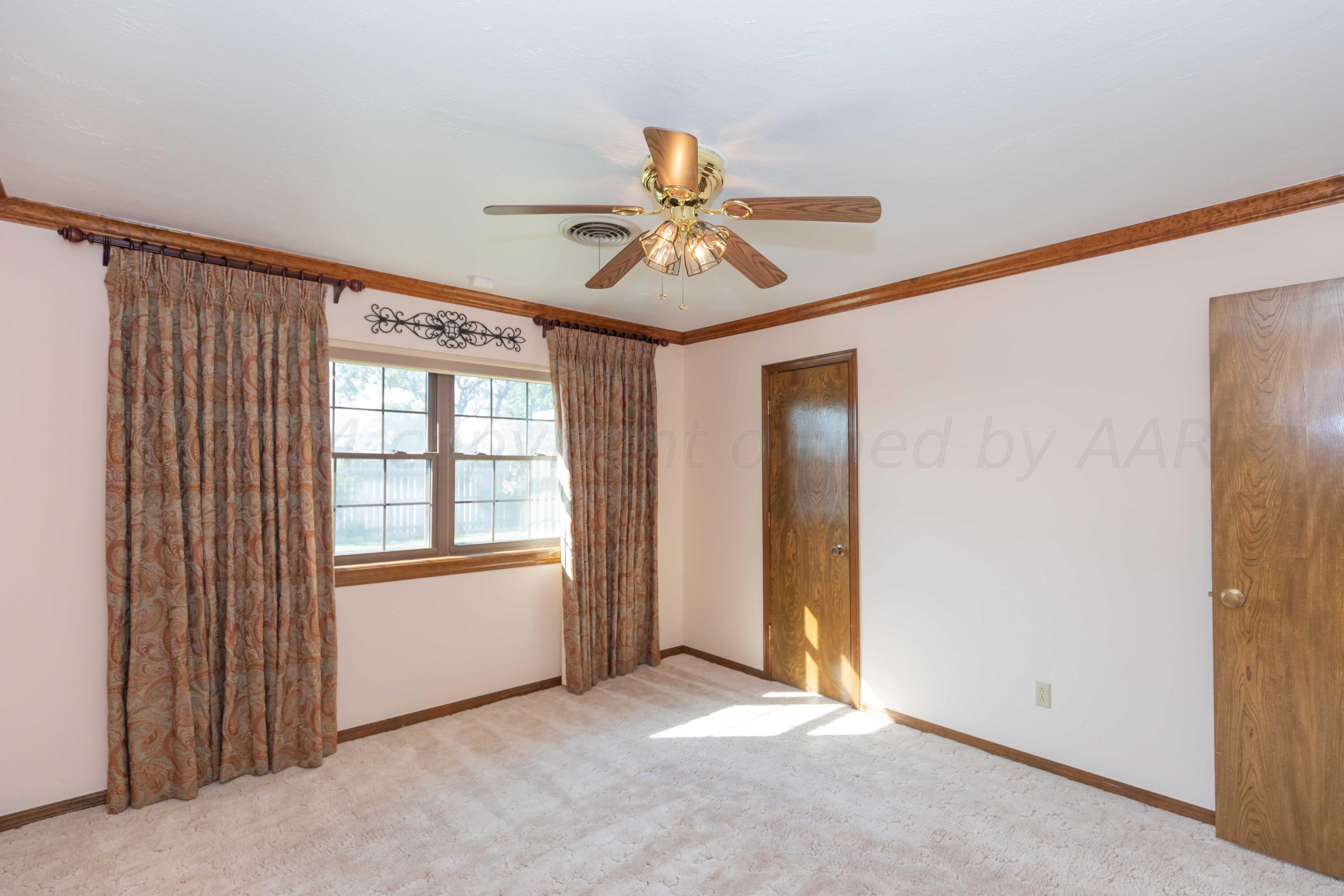 5809 Stone Drive Amarillo, TX 79109 - Photo 30 of 47 a view of an empty room with a window