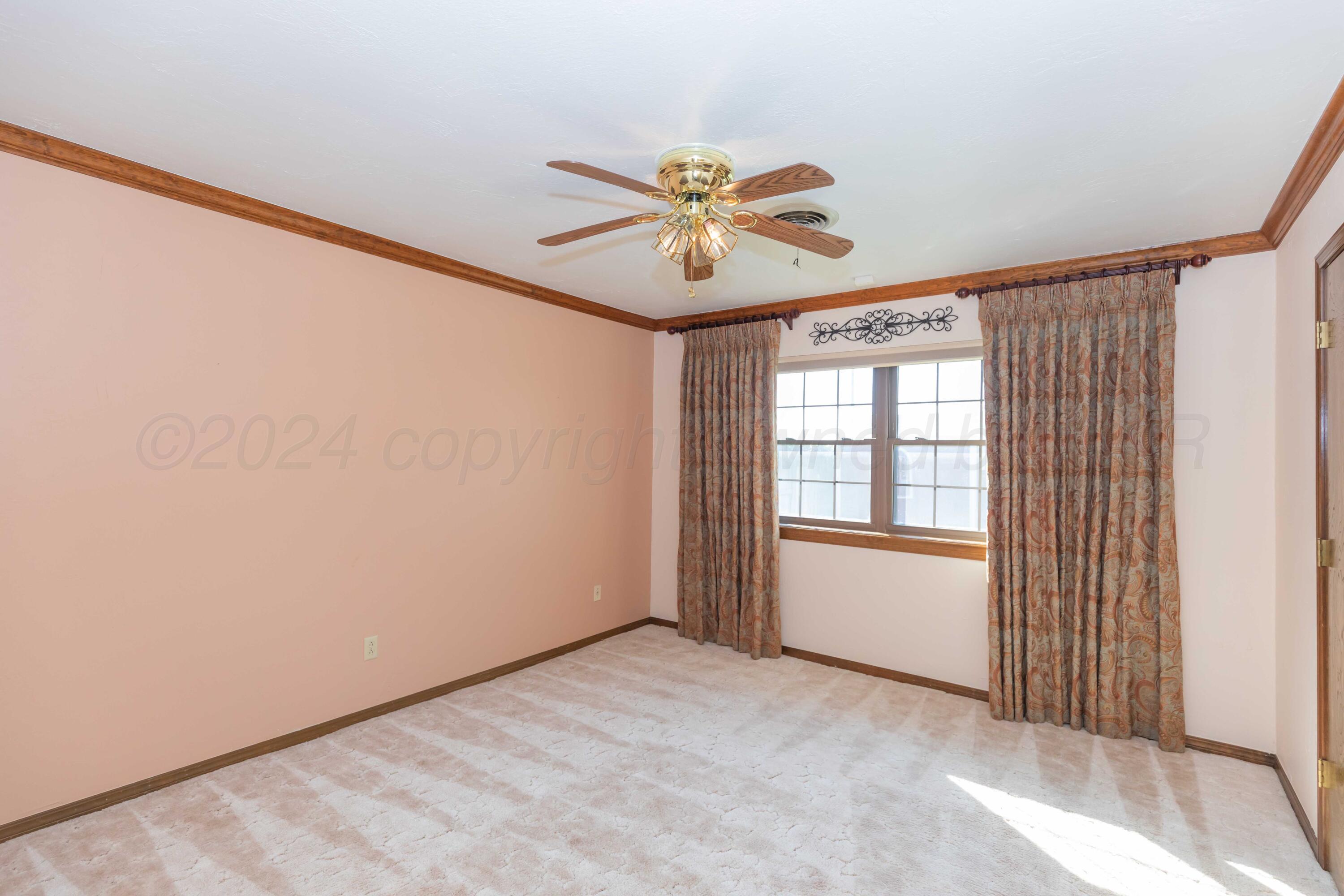 5809 Stone Drive Amarillo, TX 79109 - Photo 31 of 47 a view of an empty room with a window