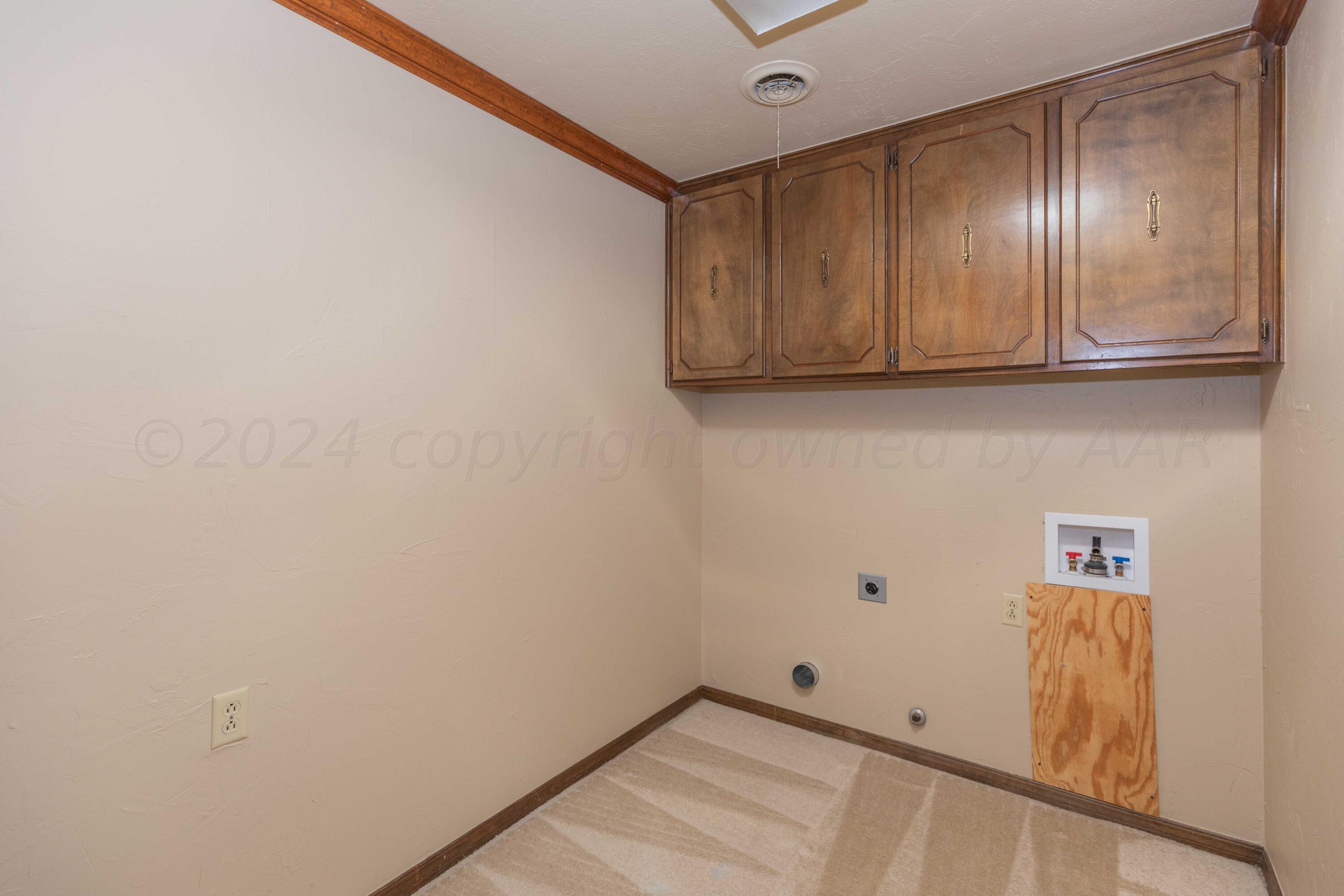 5809 Stone Drive Amarillo, TX 79109 - Photo 39 of 47 a view of storage and utility room with wooden floor