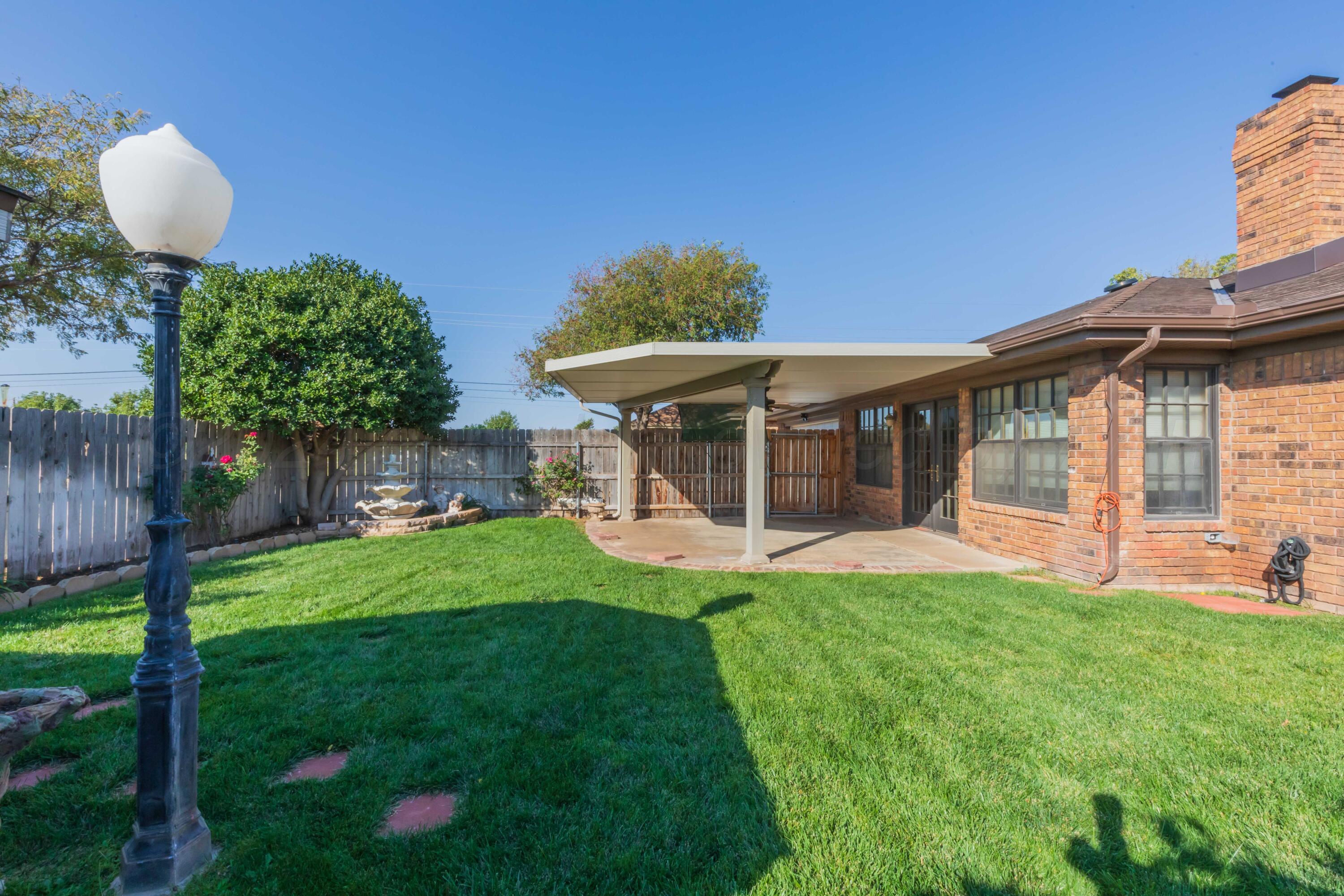 5809 Stone Drive Amarillo, TX 79109 - Photo 44 of 47 a view of a house with a backyard porch and furniture