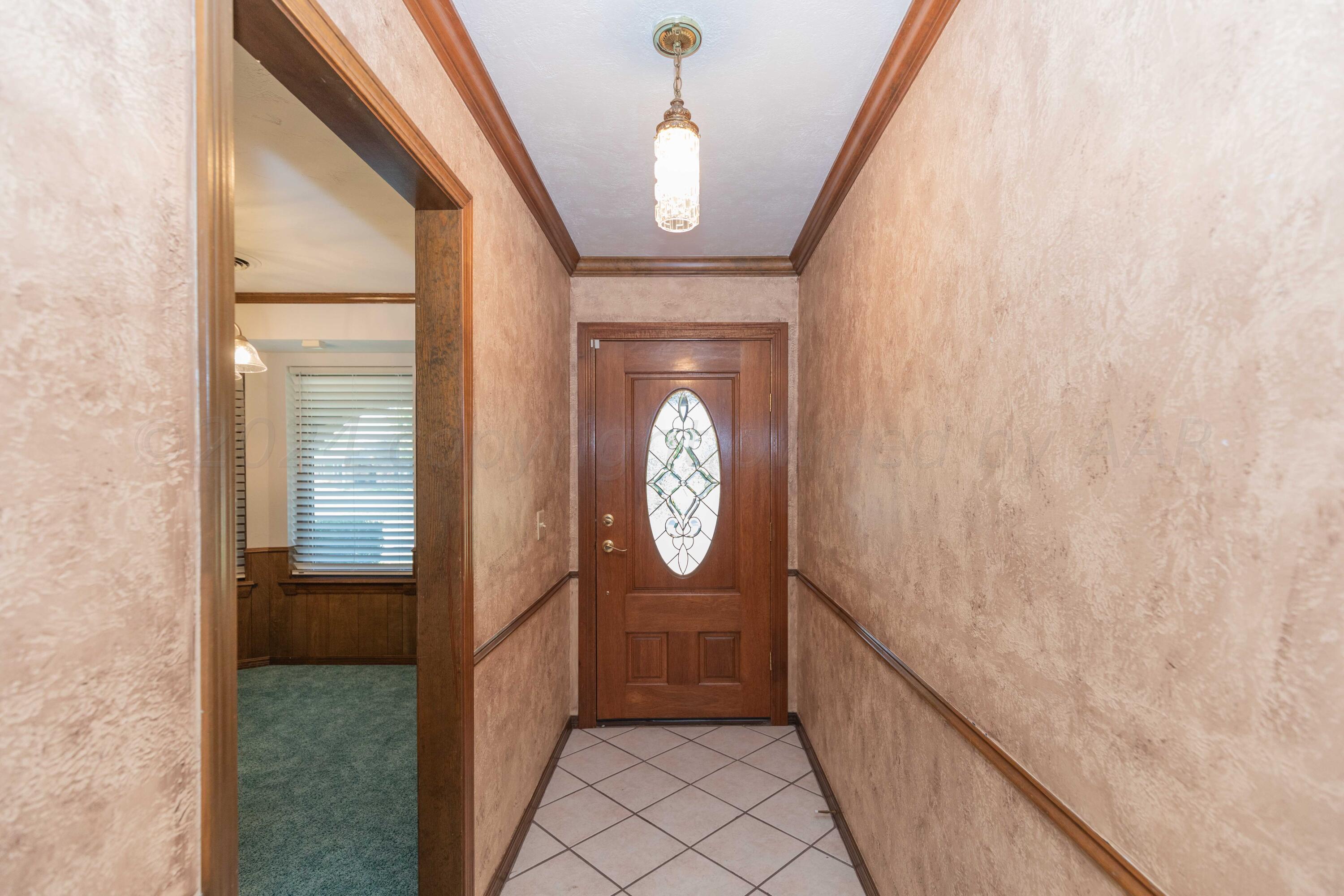 5809 Stone Drive Amarillo, TX 79109 - Photo 5 of 47 a view of gallery with wooden floor