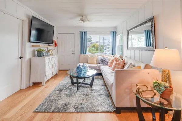 a living room with furniture and a flat screen tv