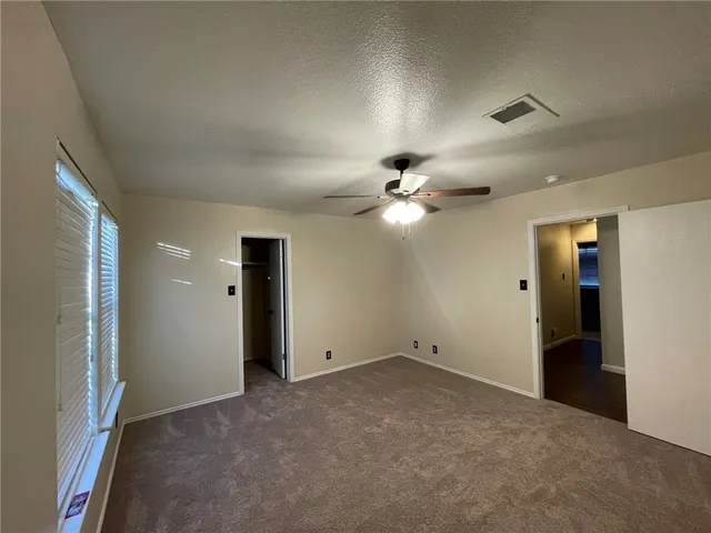 a view of a couches in backyard of house