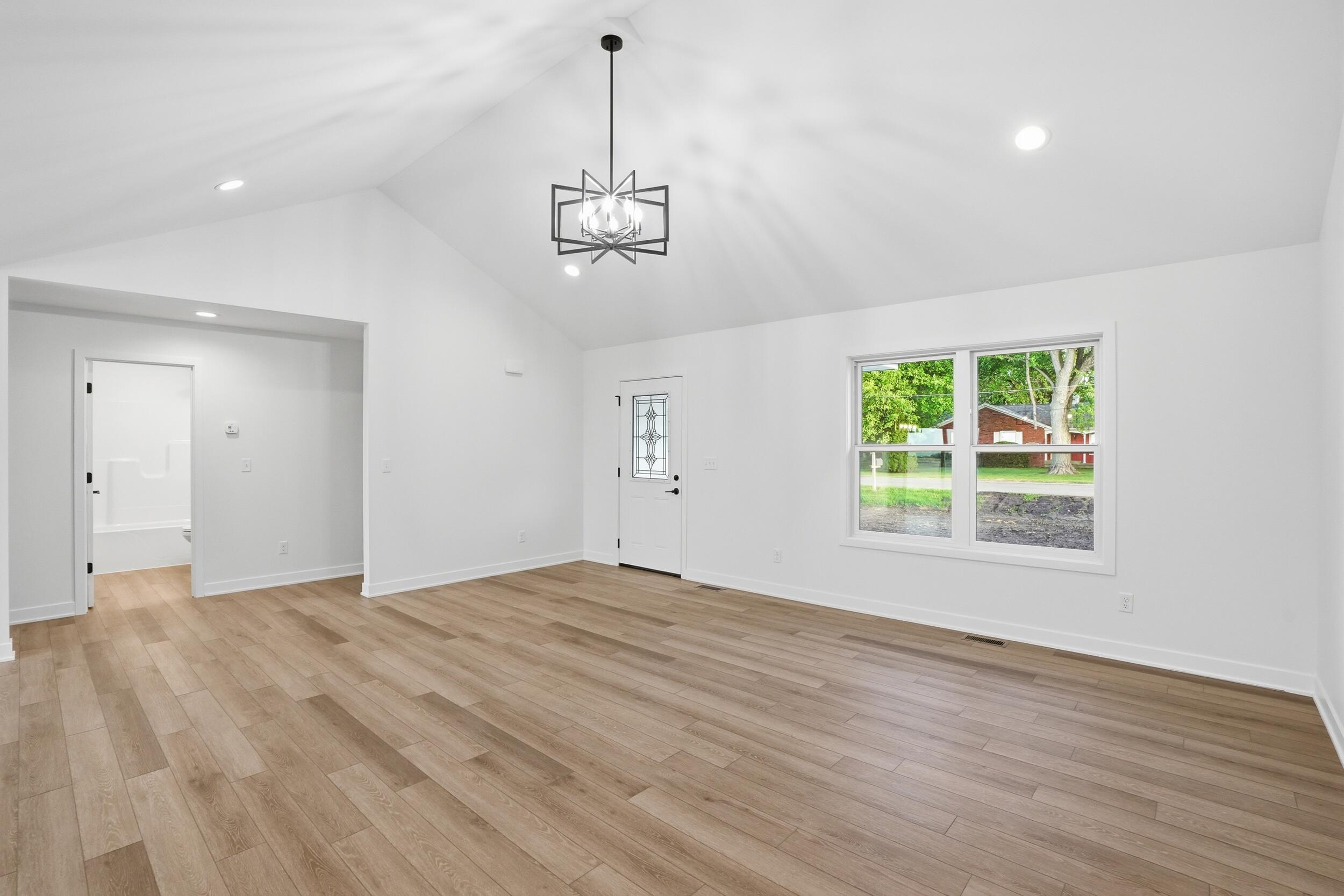 508 West Beaver Street Morocco, IN 47963 - Photo 19 of 33 a view of empty room with wooden floor and window