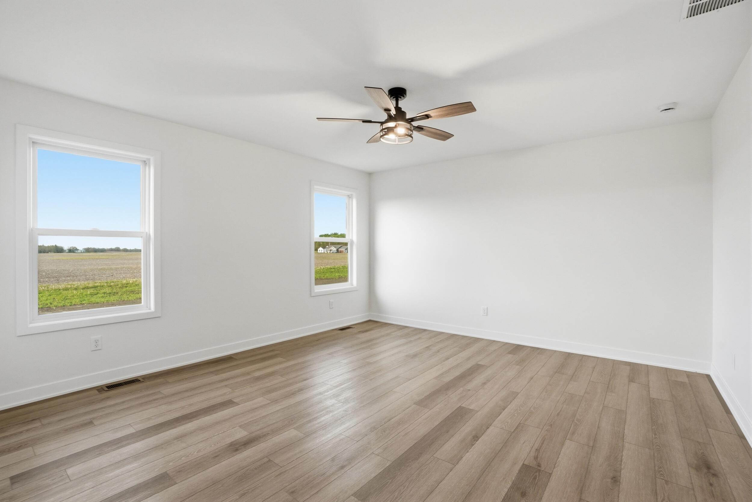 508 West Beaver Street Morocco, IN 47963 - Photo 23 of 33 an empty room with a window and a ceiling fan