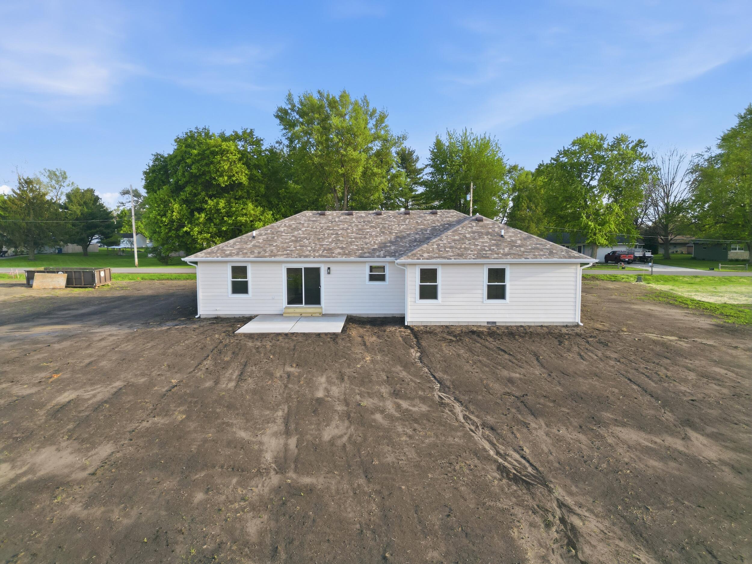 508 West Beaver Street Morocco, IN 47963 - Photo 5 of 33 a view of a house with backyard and trees