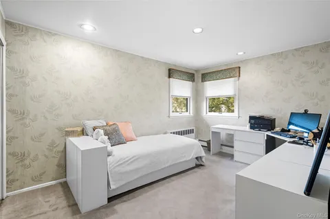 a bed room with a bed and a window