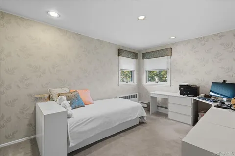 a bed room with a bed and a window