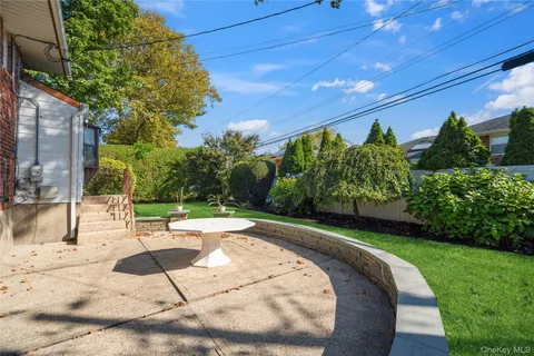 a view of a backyard with sitting area