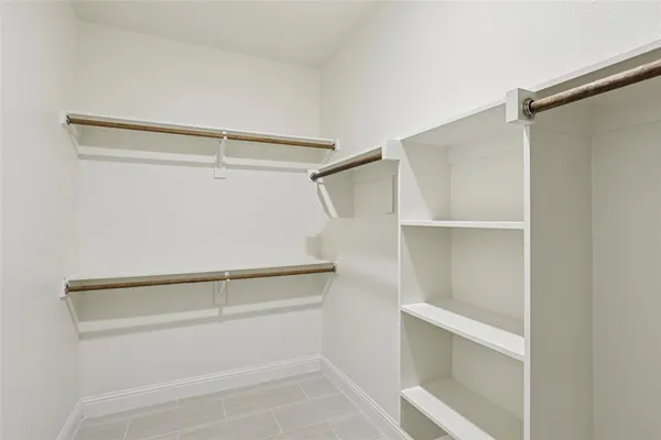 a view of an empty walk in closet