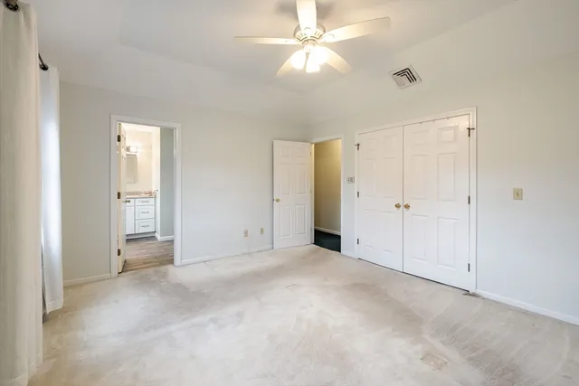 a bathroom with a granite countertop sink a mirror a shower and a bathtub