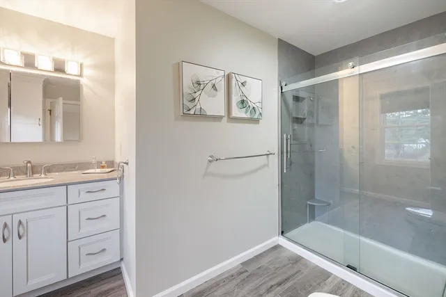 a bathroom with a tub and shower