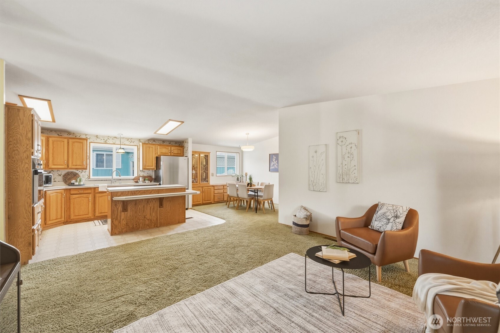 2015 24th Street, Unit 94 Bellingham, WA 98225 - Photo 11 of 40 a living room with furniture and a wooden floor