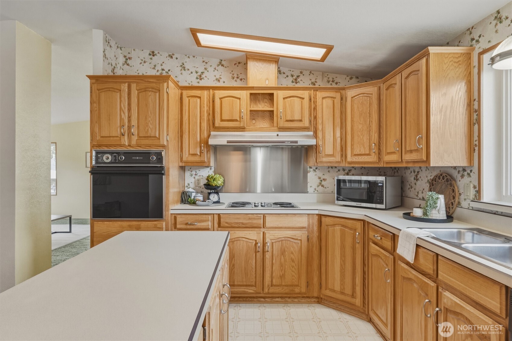 2015 24th Street, Unit 94 Bellingham, WA 98225 - Photo 12 of 40 a kitchen with stainless steel appliances granite countertop a sink and cabinets