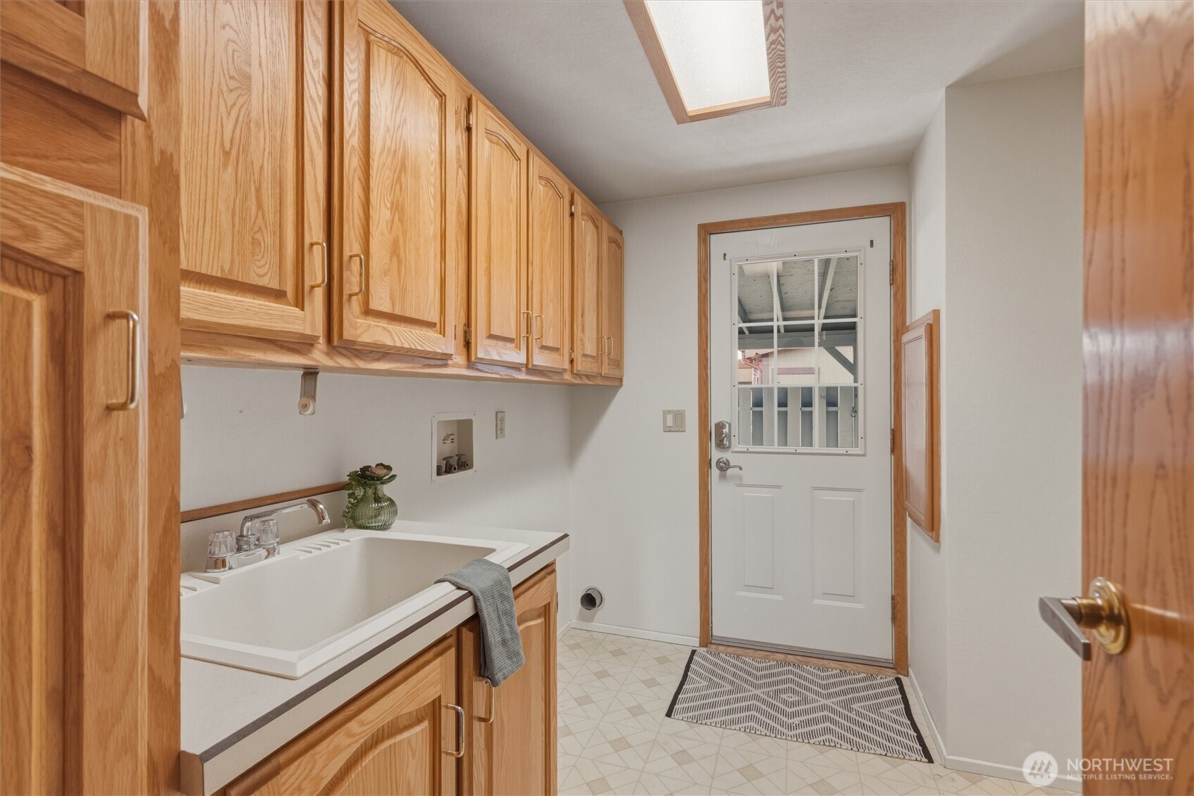 2015 24th Street, Unit 94 Bellingham, WA 98225 - Photo 17 of 40 a storage room with a sink and cabinets