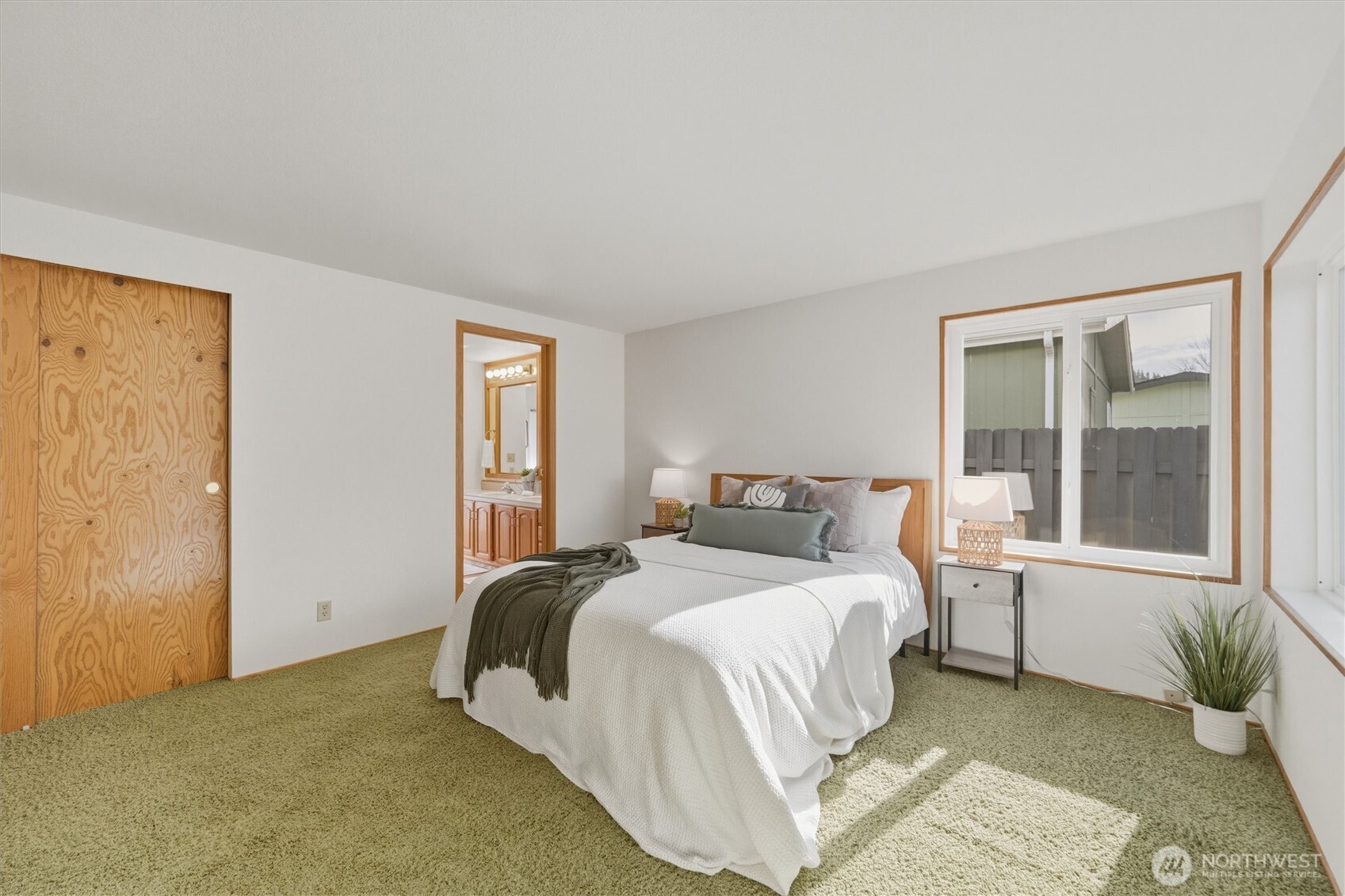 2015 24th Street, Unit 94 Bellingham, WA 98225 - Photo 19 of 40 a bedroom with a bed and a large window