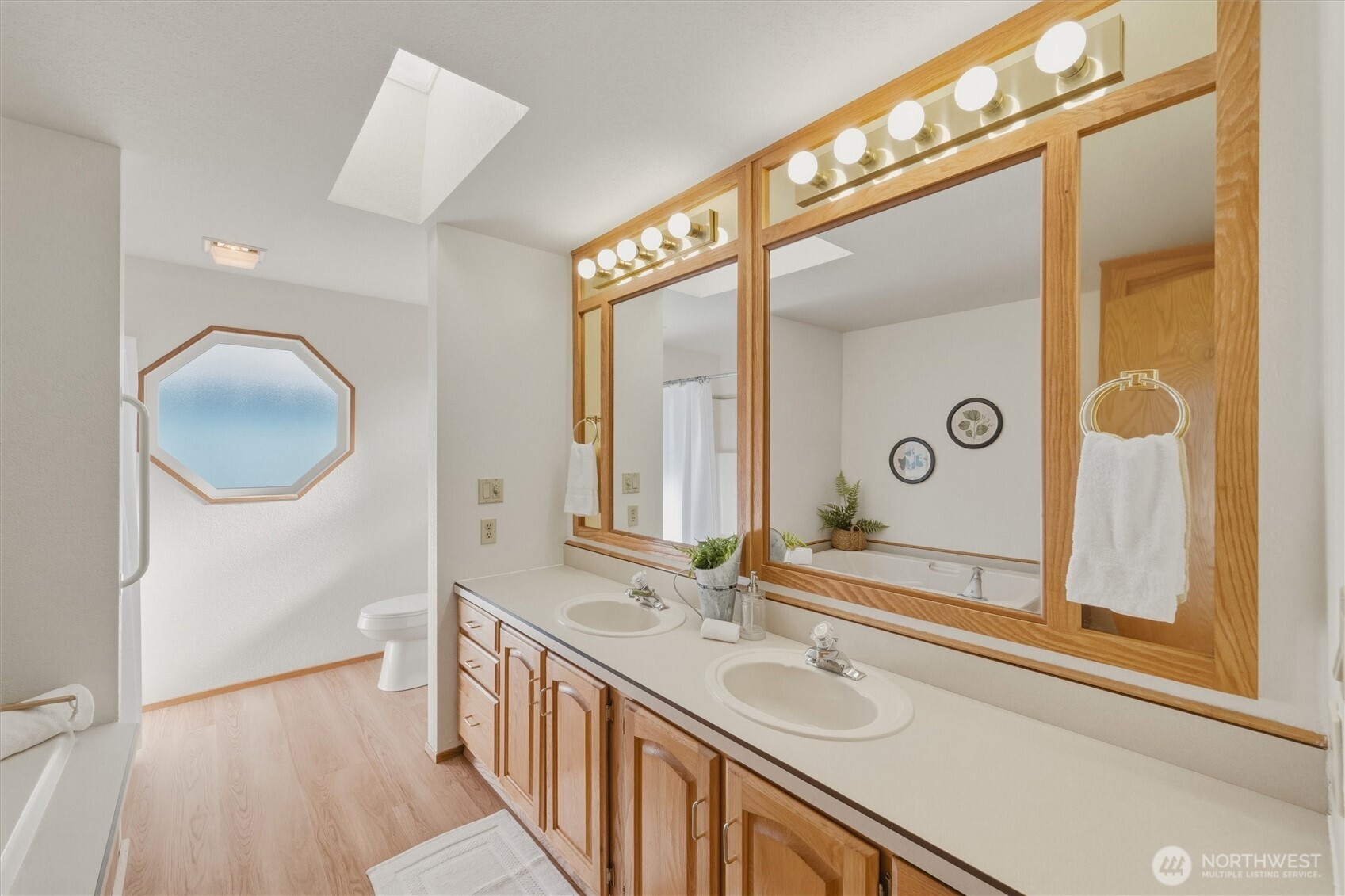 2015 24th Street, Unit 94 Bellingham, WA 98225 - Photo 20 of 40 a bathroom with a double vanity sink and mirror