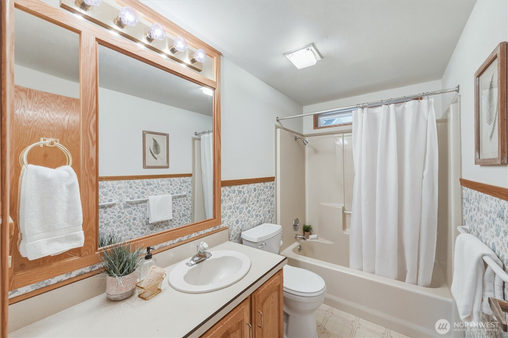 2015 24th Street, Unit 94 Bellingham, WA 98225 - Photo 26 of 40 a bathroom with a sink vanity mirror and toilet