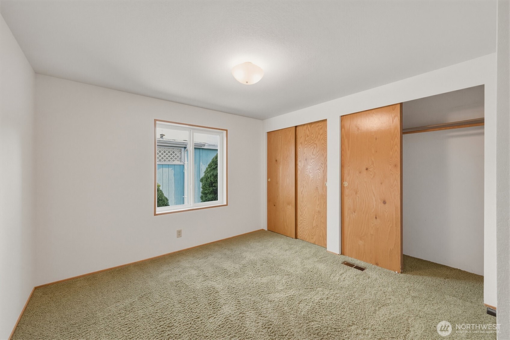 2015 24th Street, Unit 94 Bellingham, WA 98225 - Photo 27 of 40 an empty room with windows and closet