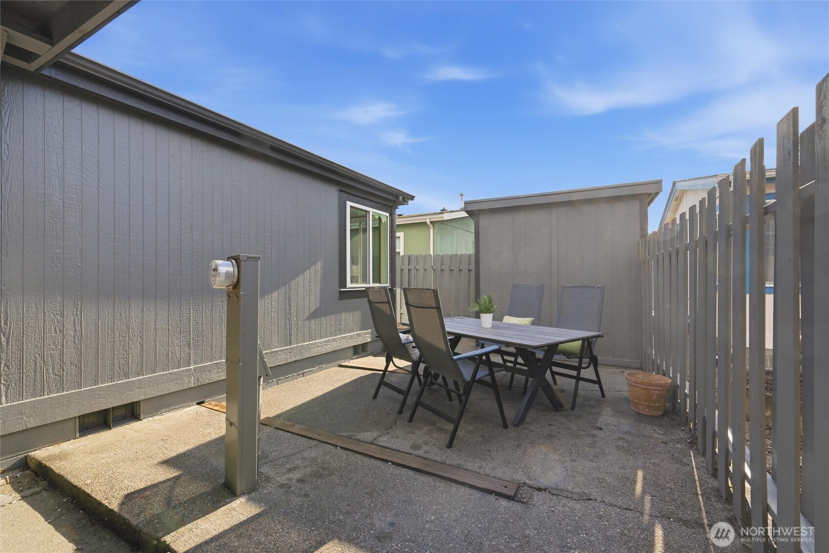 2015 24th Street, Unit 94 Bellingham, WA 98225 - Photo 29 of 40 a view of a patio with table and chairs
