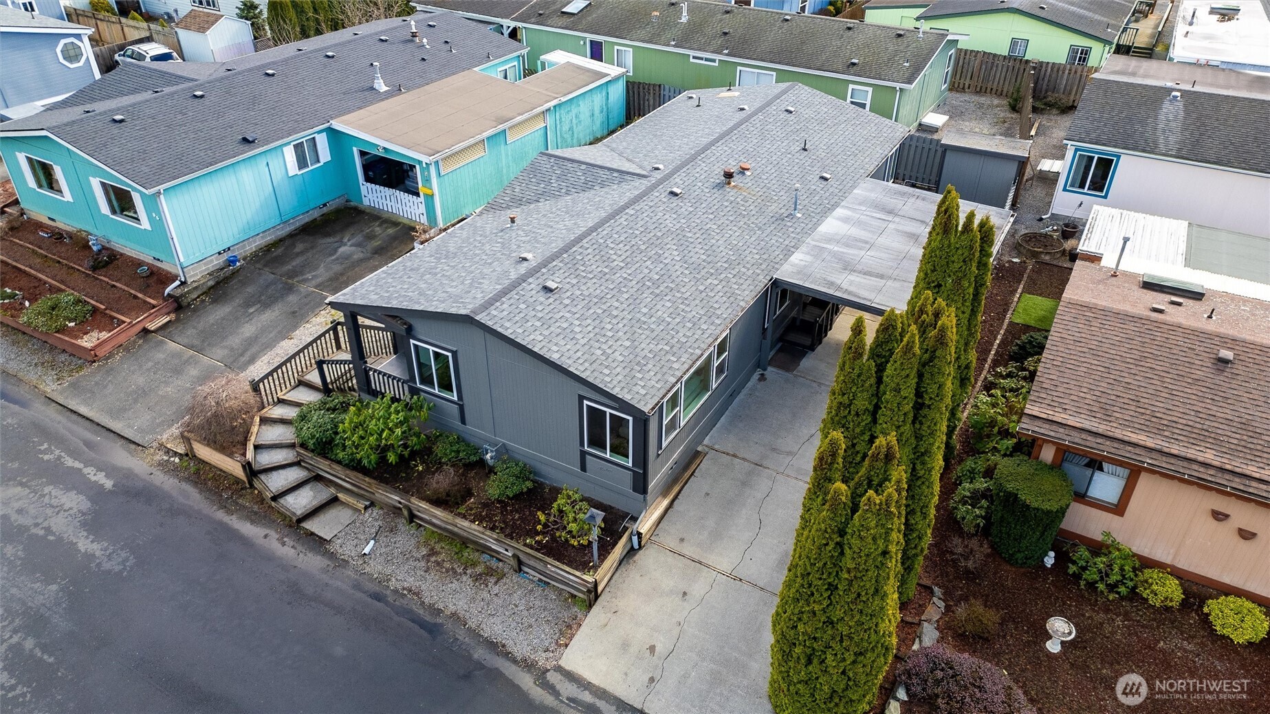 2015 24th Street, Unit 94 Bellingham, WA 98225 - Photo 31 of 40 an aerial view of a house with garden space and street view