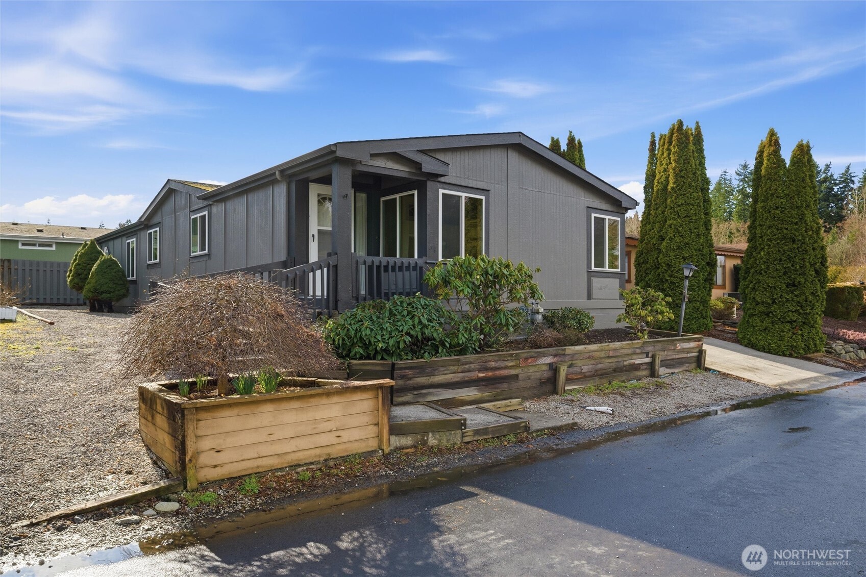 2015 24th Street, Unit 94 Bellingham, WA 98225 - Photo 32 of 40 a front view of a house with a yard