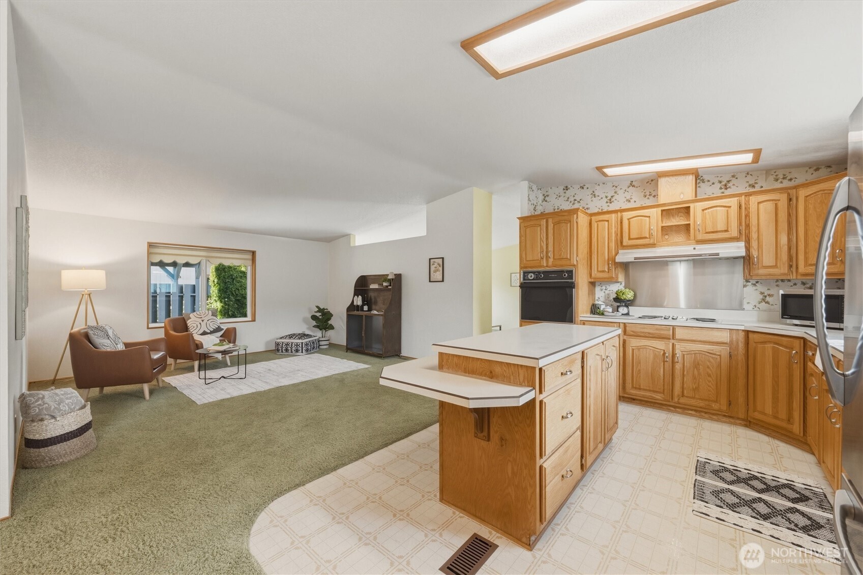 2015 24th Street, Unit 94 Bellingham, WA 98225 - Photo 9 of 40 a kitchen with a sink stove and cabinets