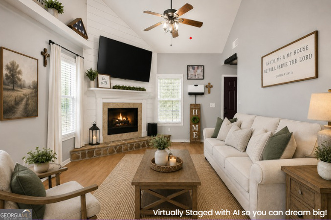 1825 Harden Road Zebulon, GA 30295 - Photo 8 of 32 a living room with furniture a flat screen tv and a fireplace