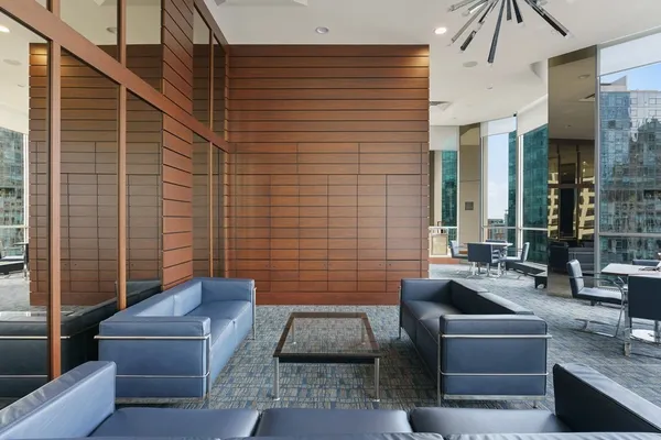 a view of patio with couches and pool