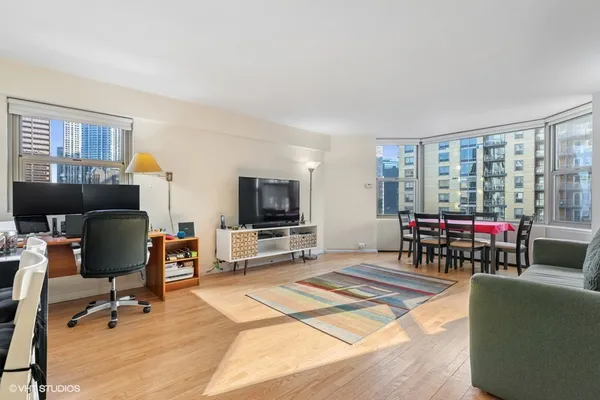 a living room with furniture a projector and a flat screen tv