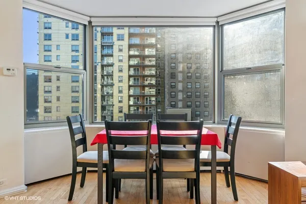 a room with a table and chairs