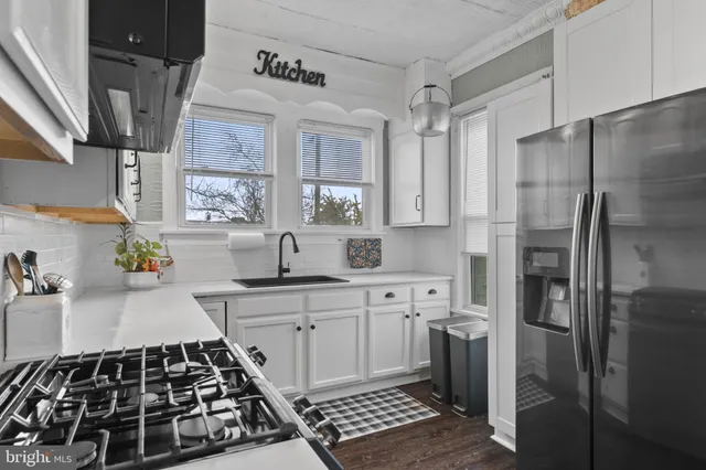 a bathroom with a sink a mirror and shower