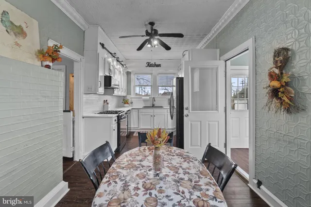 a bathroom with a white bath tub a shower and a sink