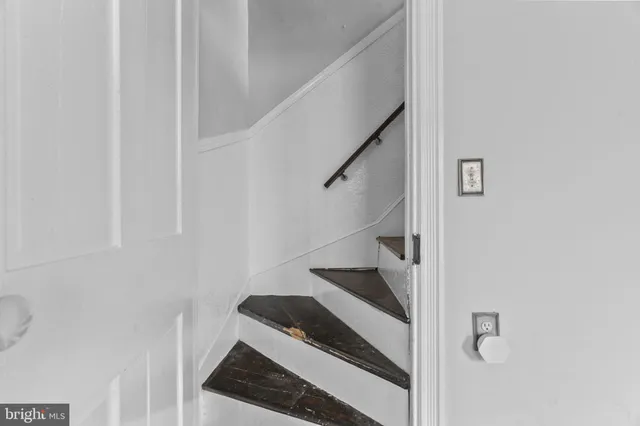 a view of a bedroom with furniture and windows