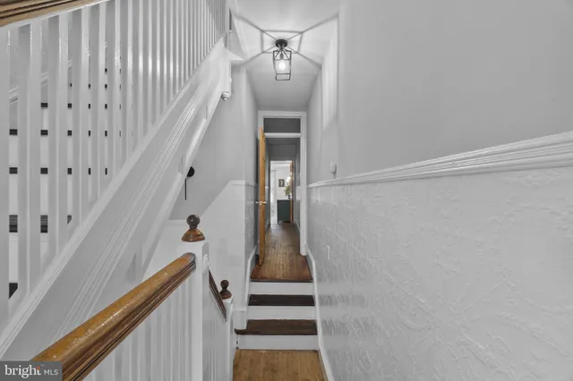 a view of bedroom with furniture and flat screen tv