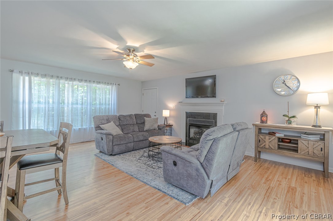 11654 Courthouse Road Lancaster, VA 22503 - Photo 4 of 35 a living room with furniture and a fireplace