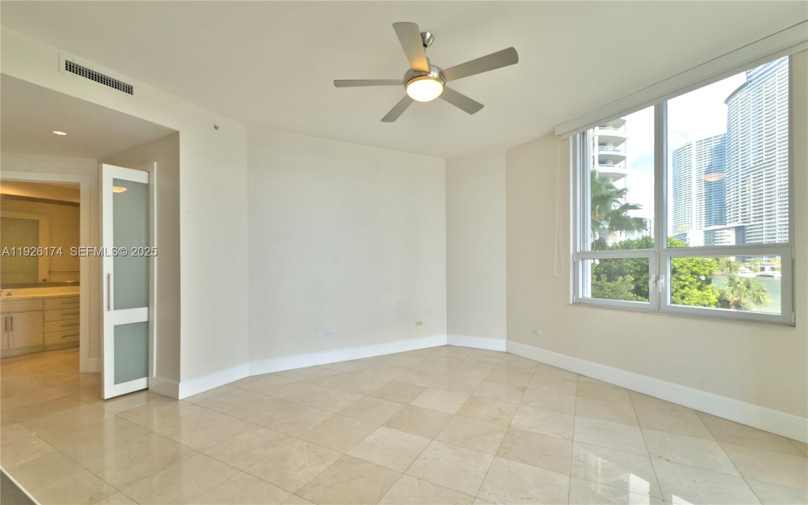 848 Brickell Key Drive, Unit 306 Miami, FL 33131 - Photo 13 of 66 a view of an empty room with a window