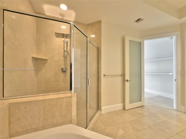 a bathroom with a tub sink toilet and a mirror