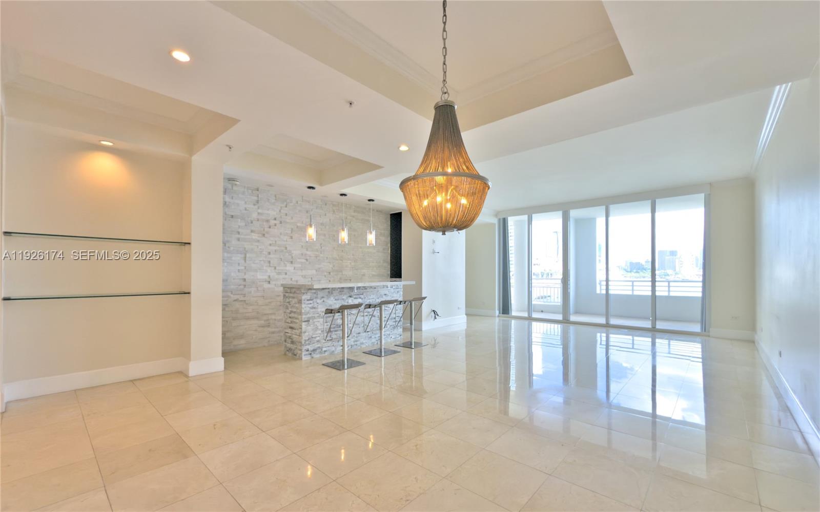 848 Brickell Key Drive, Unit 306 Miami, FL 33131 - Photo 2 of 66 a view of a room with wooden floor and windows