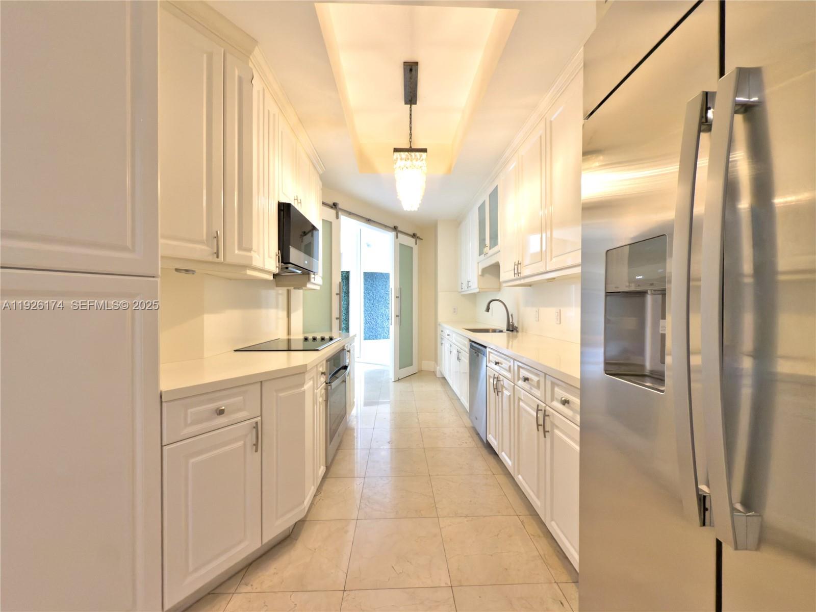 848 Brickell Key Drive, Unit 306 Miami, FL 33131 - Photo 22 of 66 a bathroom with a granite countertop double vanity and a mirror