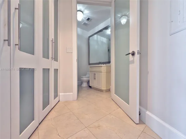 a view of pool of water with tall buildings