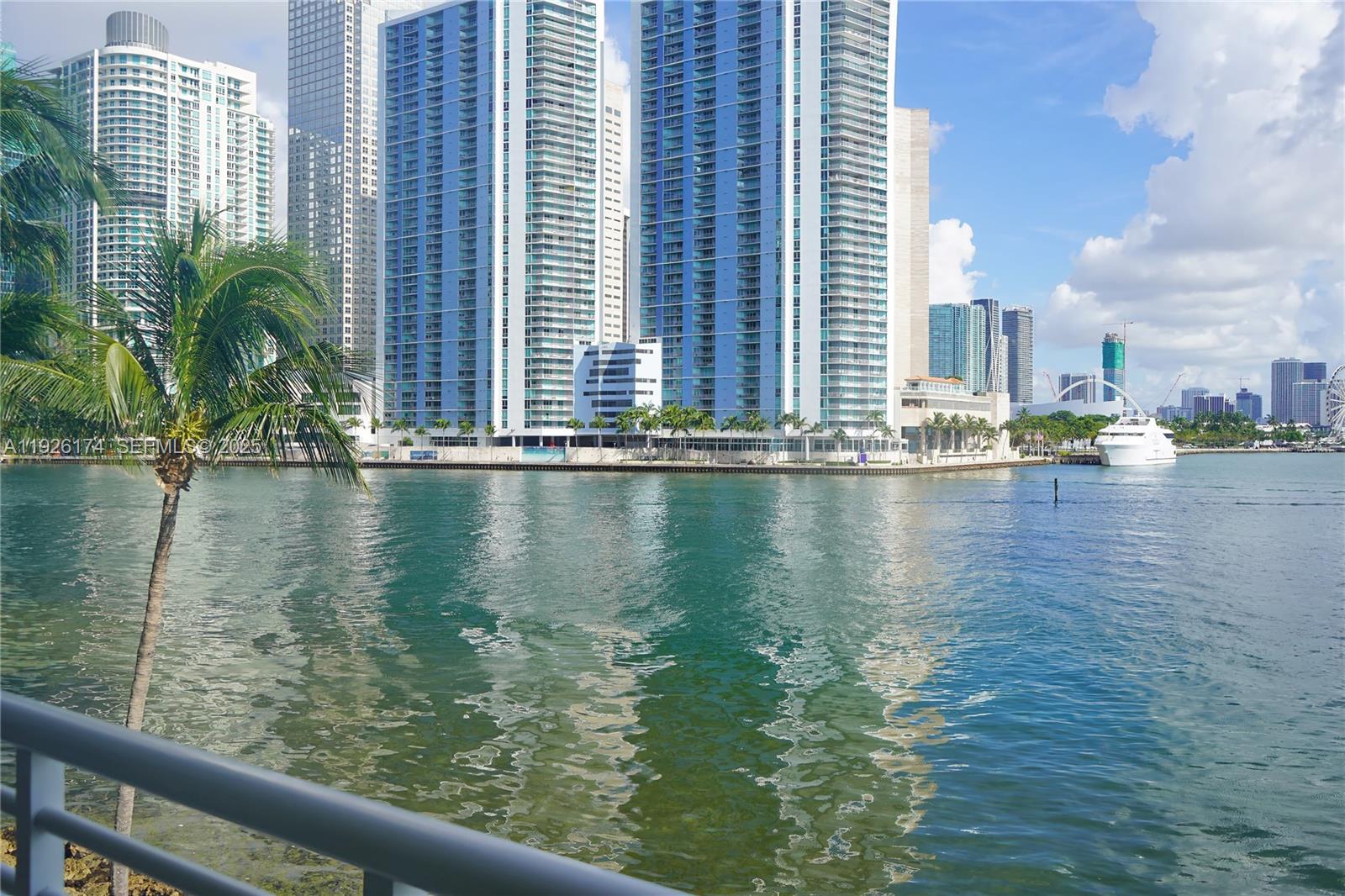 848 Brickell Key Drive, Unit 306 Miami, FL 33131 - Photo 33 of 66 a view of pool of water with tall buildings