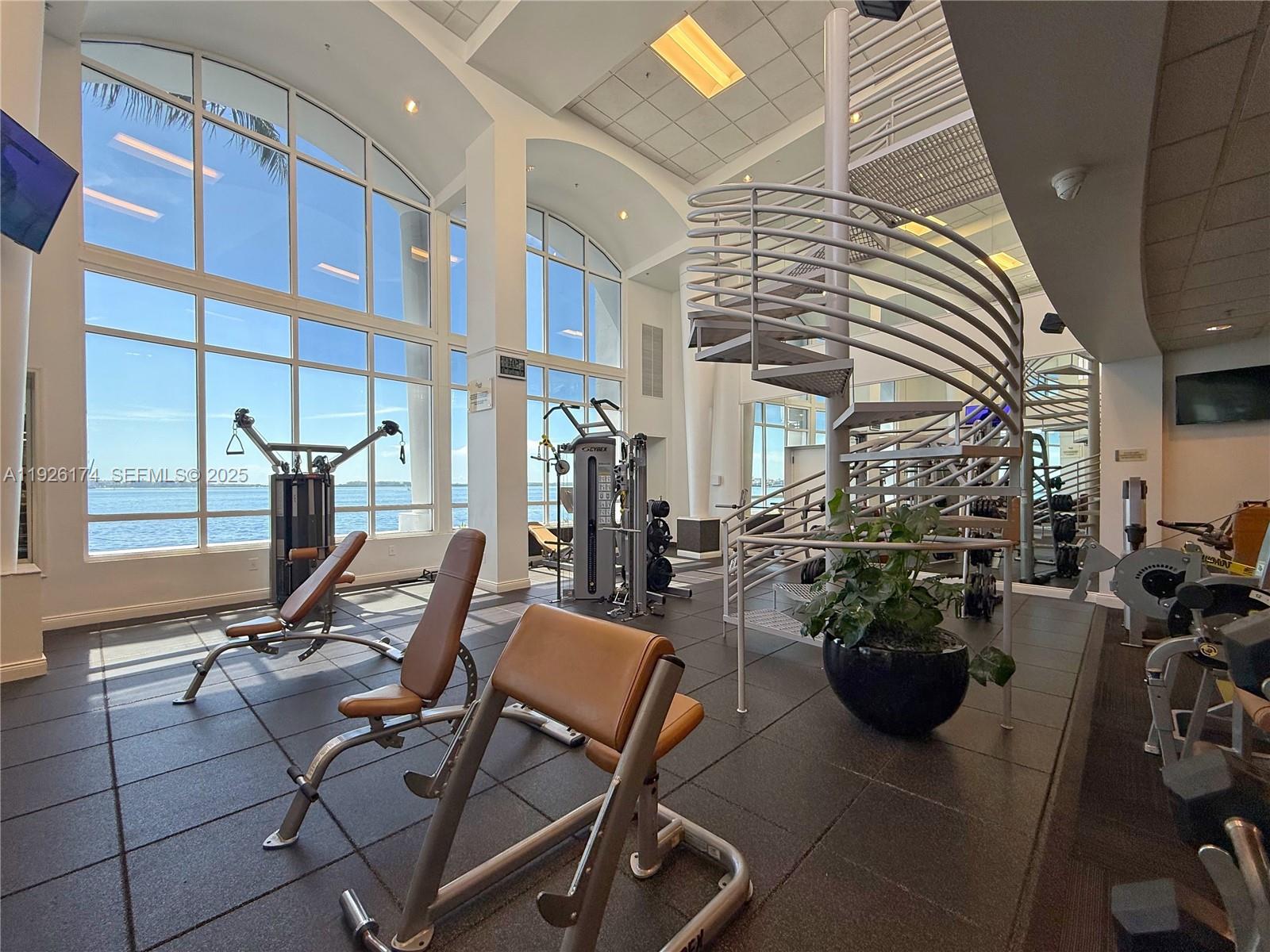 848 Brickell Key Drive, Unit 306 Miami, FL 33131 - Photo 35 of 66 a view of a chairs and tables in patio